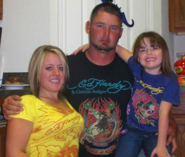 a family dressed in ed hardy t-shirts